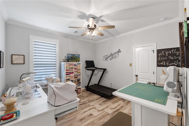 office area with ceiling fan, light hardwood / wood-style flooring, and ornamental molding