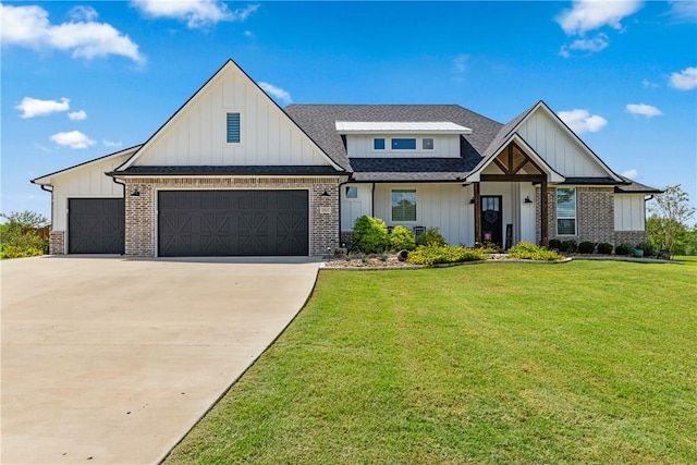 view of front of house with a front lawn and a garage