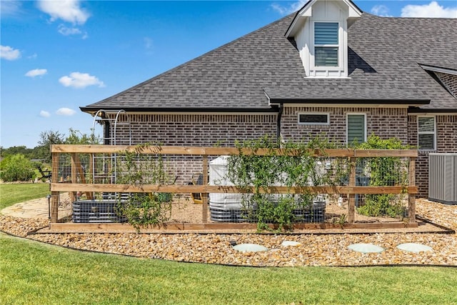 rear view of property with a lawn