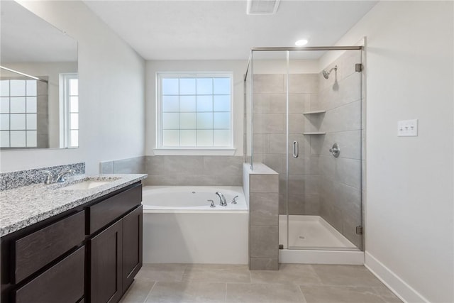 bathroom featuring separate shower and tub, tile patterned floors, and vanity