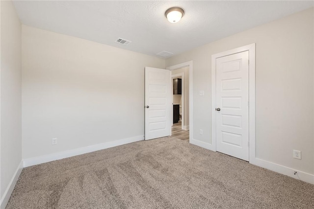 unfurnished room with carpet floors