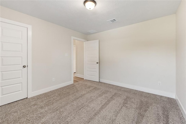 empty room with carpet flooring