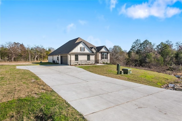 craftsman-style home featuring a garage and a front yard