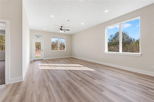 spare room with ceiling fan and light hardwood / wood-style flooring