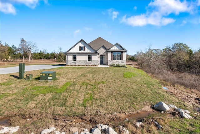 craftsman-style home with a front lawn