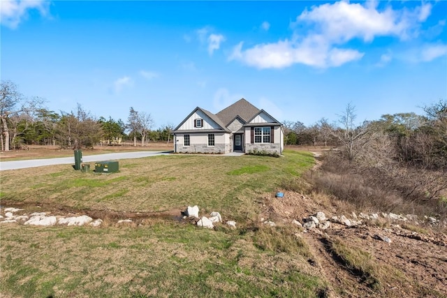 craftsman-style home with a front lawn