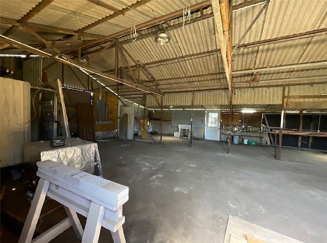 409 S Ave, C, TX 77541 - misc room with electric panel, concrete flooring, and vaulted ceiling