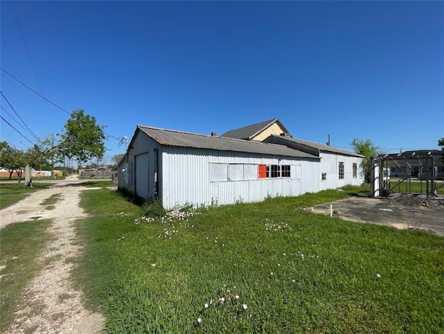 409 S Ave, C, TX 77541 - view of home's exterior with a lawn