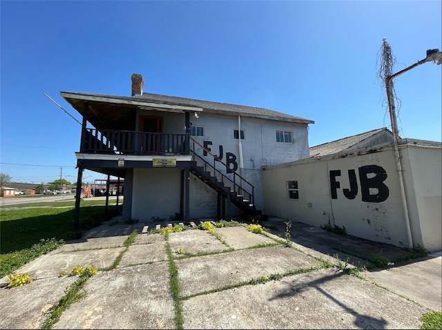 409 S Ave, C, TX 77541 - back of property with stairway
