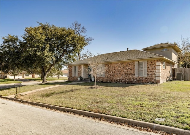 view of front facade with central AC and a front lawn