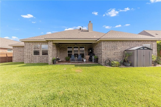 4004 Wild Creek Ct, College Station, TX 77845 - rear view of property featuring a patio, a shed, brick siding, and a chimney
