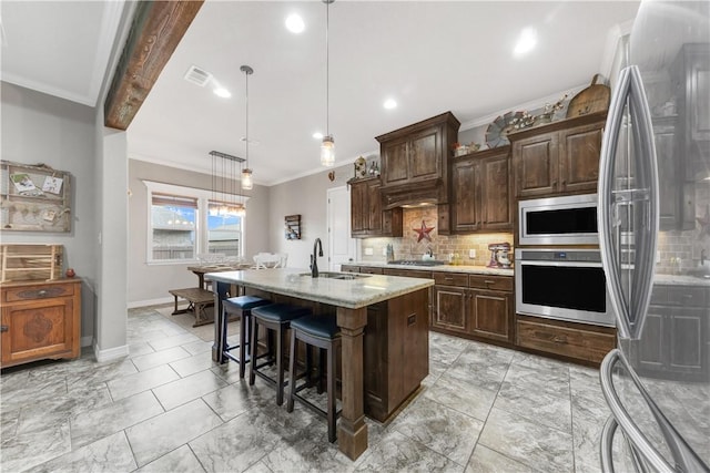 4004 Wild Creek Ct, College Station, TX 77845 - kitchen featuring stainless steel appliances, backsplash, ornamental molding, light marble finish floors, and a breakfast bar
