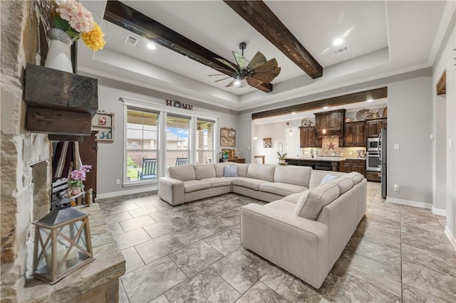 4004 Wild Creek Ct, College Station, TX 77845 - living area featuring a ceiling fan, beam ceiling, and a tray ceiling