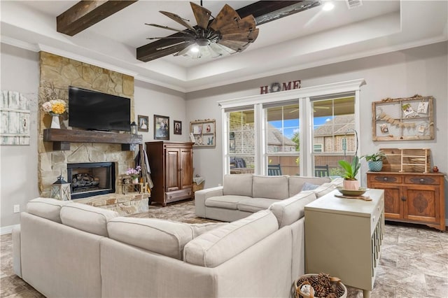 4004 Wild Creek Ct, College Station, TX 77845 - living room with a raised ceiling, ceiling fan, ornamental molding, and a stone fireplace