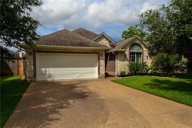 view of front of house with a front lawn and a garage