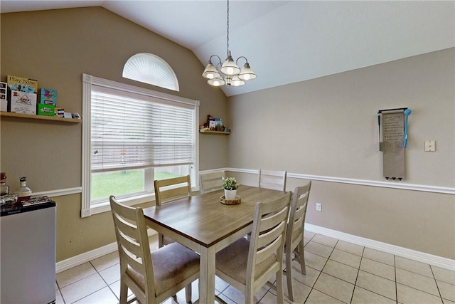 tiled dining space with a chandelier and lofted ceiling