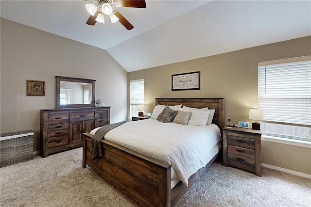 bedroom featuring light carpet, vaulted ceiling, and ceiling fan