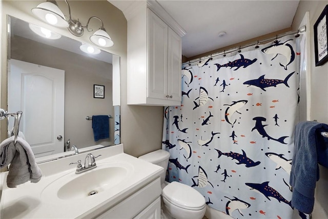 bathroom with vanity, curtained shower, and toilet