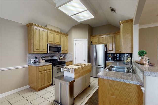 kitchen with decorative backsplash, stainless steel appliances, sink, light tile patterned floors, and lofted ceiling