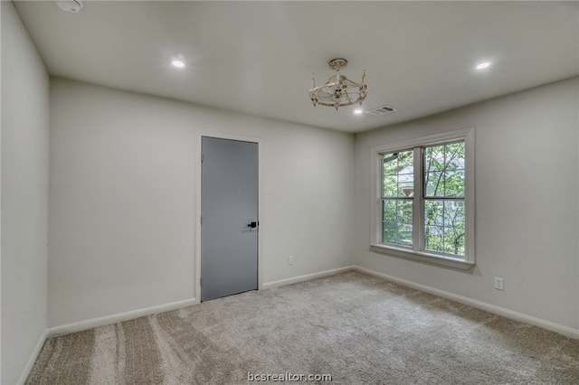 view of carpeted spare room