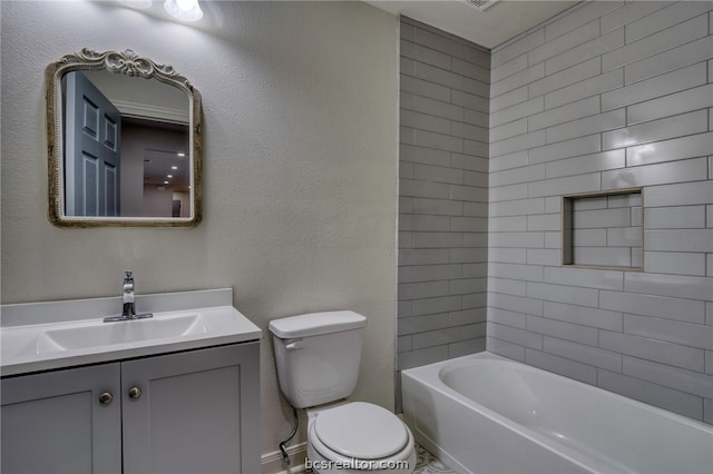 full bathroom featuring vanity, toilet, and tiled shower / bath