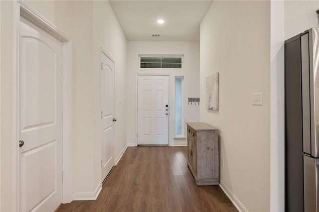 corridor featuring dark hardwood / wood-style floors