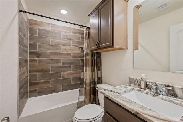 full bathroom featuring toilet, vanity, and shower / tub combo with curtain