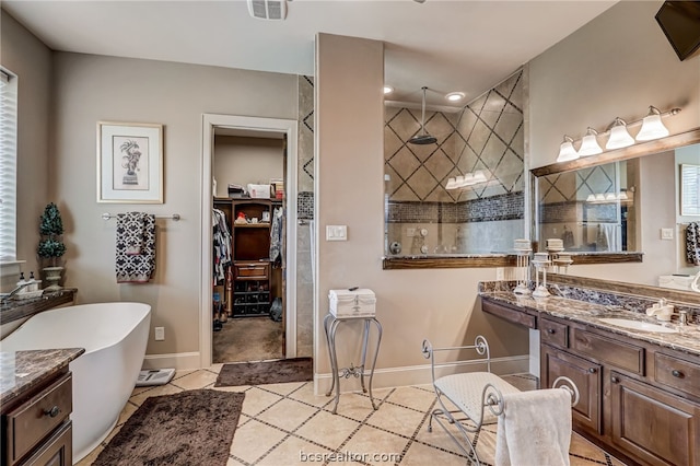 bathroom with separate shower and tub, tile patterned floors, and vanity