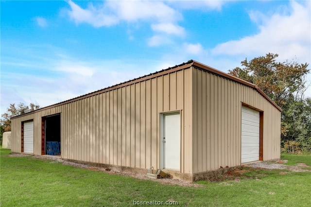 garage featuring a yard