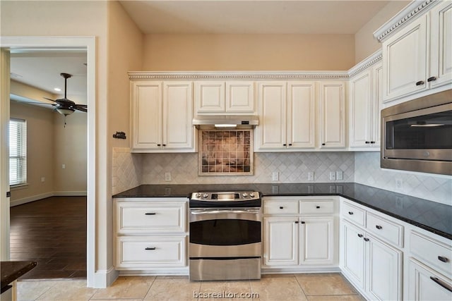 kitchen with ceiling fan, tasteful backsplash, light hardwood / wood-style flooring, white cabinets, and appliances with stainless steel finishes