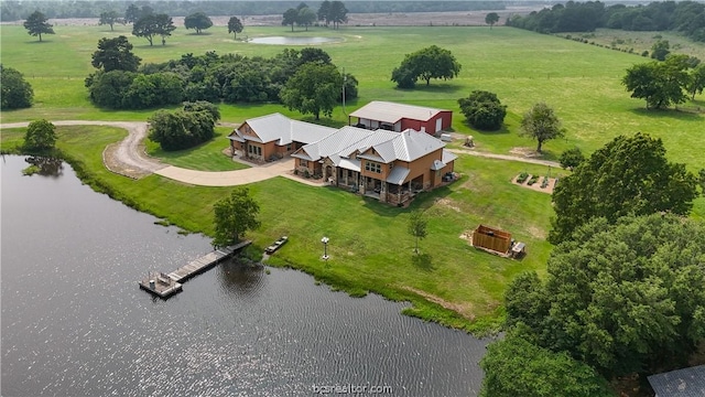 drone / aerial view featuring a rural view and a water view