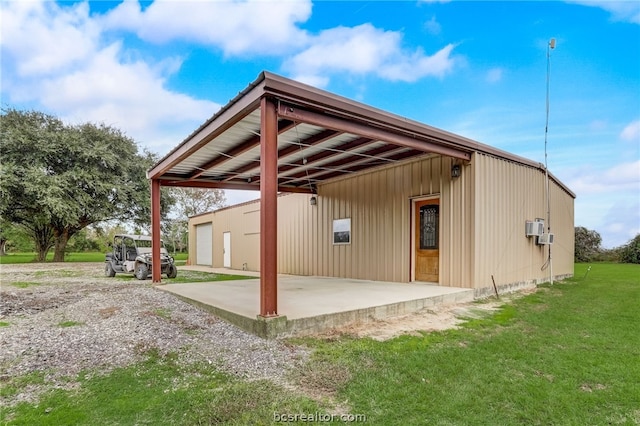 exterior space featuring an outbuilding and a garage