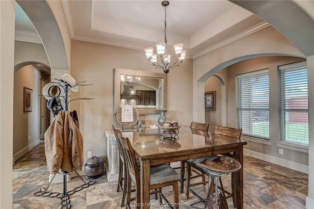 dining room with crown molding and an inviting chandelier