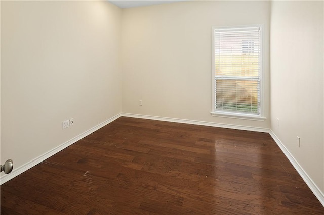 unfurnished room featuring dark hardwood / wood-style floors