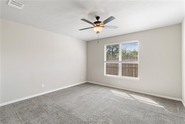 spare room featuring ceiling fan and carpet