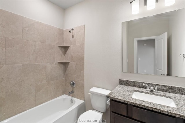 full bathroom with vanity, toilet, and tiled shower / bath