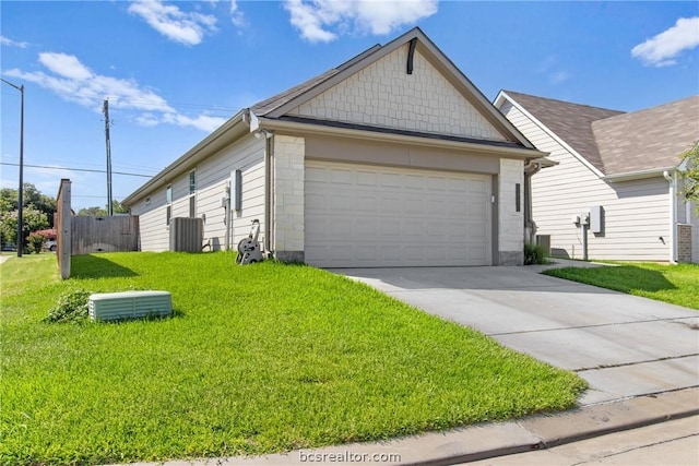 view of front of house with a garage and a front lawn