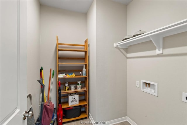 washroom with hookup for an electric dryer and hookup for a washing machine