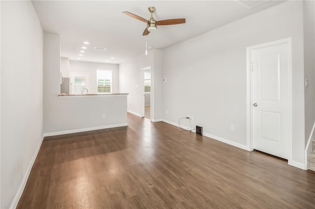 996 Marquis Dr, Bryan, TX 77803 - empty room with ceiling fan, dark wood-style flooring, baseboards, recessed lighting, and a sink