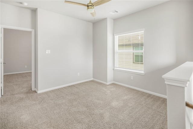 996 Marquis Dr, Bryan, TX 77803 - empty room with light colored carpet, ceiling fan, baseboards, and a smoke detector