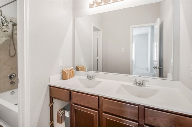 996 Marquis Dr, Bryan, TX 77803 - bathroom with double vanity and shower / washtub combination
