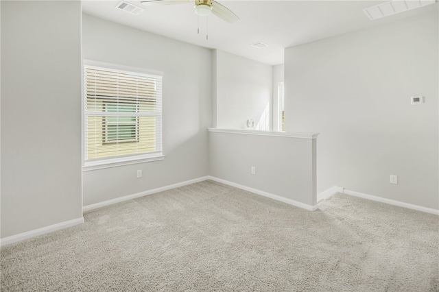 996 Marquis Dr, Bryan, TX 77803 - empty room with carpet flooring, plenty of natural light, ceiling fan, and baseboards