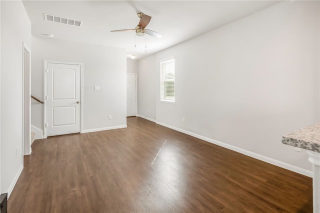 996 Marquis Dr, Bryan, TX 77803 - spare room featuring wood finished floors, ceiling fan, and baseboards