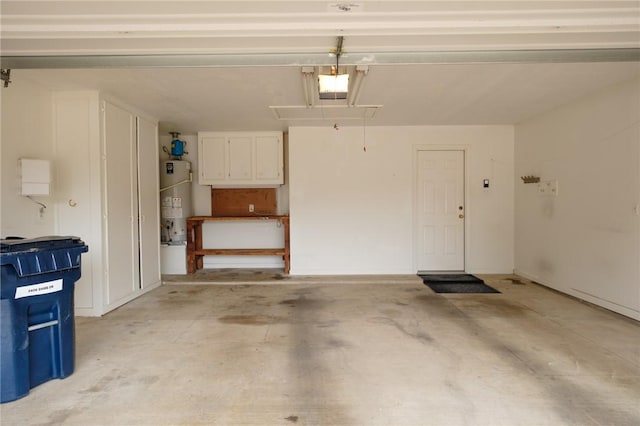 garage with a garage door opener and water heater