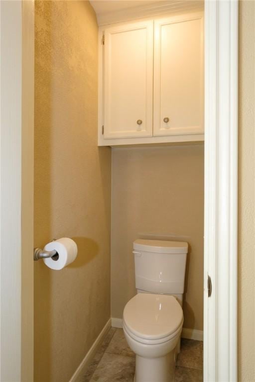 bathroom with tile patterned floors and toilet