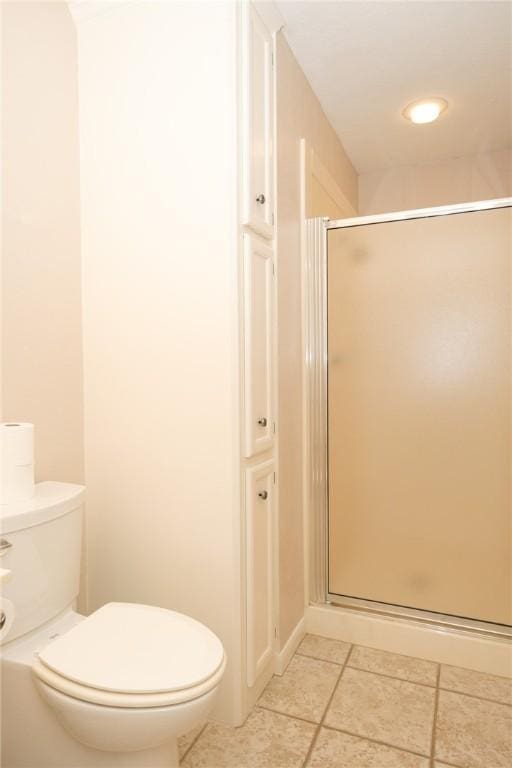 bathroom featuring toilet and walk in shower