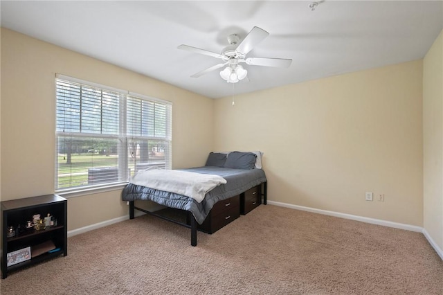 1725 Harvey Mitchell Pkwy, College Station, TX 77840 - carpeted bedroom with baseboards and a ceiling fan