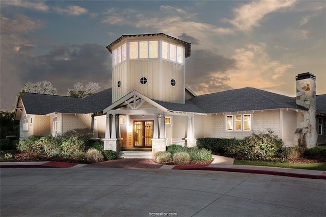 1725 Harvey Mitchell Pkwy, College Station, TX 77840 - view of front facade featuring a chimney and french doors