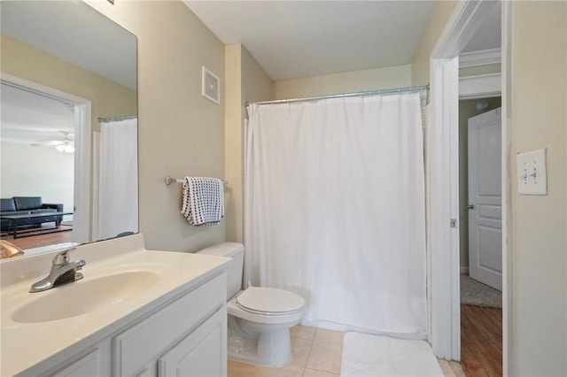 1725 Harvey Mitchell Pkwy, College Station, TX 77840 - bathroom featuring toilet, vanity, tile patterned floors, and a shower with curtain