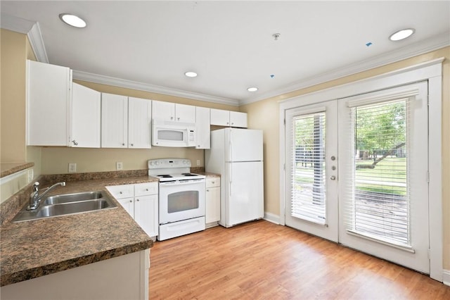 1725 Harvey Mitchell Pkwy, College Station, TX 77840 - kitchen featuring white appliances, a sink, ornamental molding, dark countertops, and light wood-style flooring